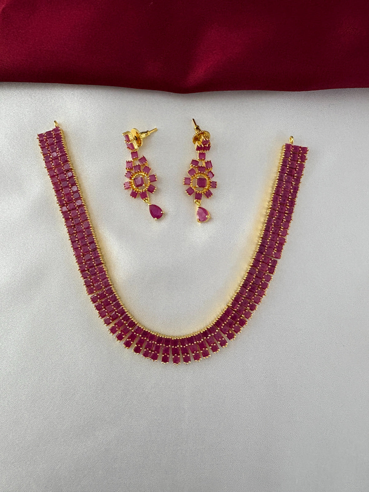 Gold-Plated Ruby Bar Necklace & Floral Earring Set - Regal Radiance – Gold Plated Ruby Bar Necklace & Earring – front view
