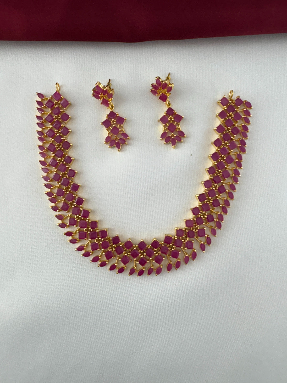 Gold-Plated Ruby Petal Cluster Necklace Set - Modern Festive Shine – Gold Plated Ruby Petal Cluster Necklace and – front view