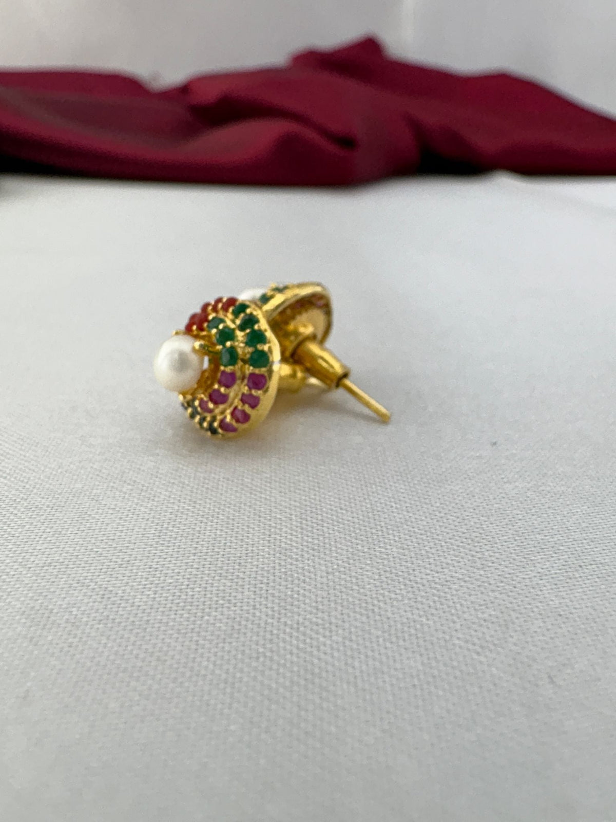 Auspicious Navaratna-Style AD Stud Earrings – Auspicious Navaratna AD stud earrings side angle showing gold post – view 2