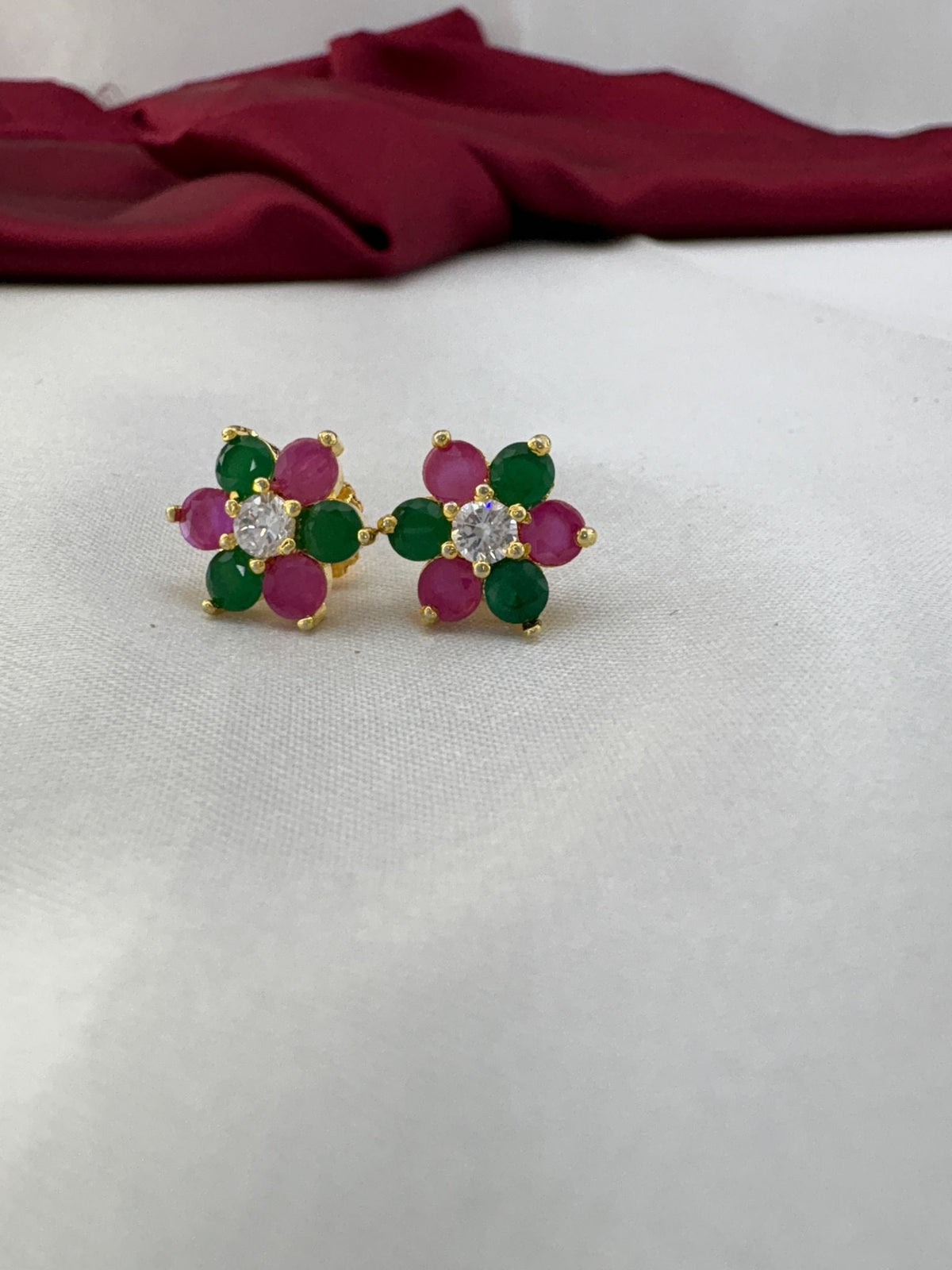 Confetti Pop multi-color AD stud earrings pair featuring festive rainbow stones celebration in cluster – front view