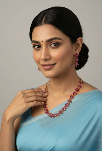 Gold Plated Ruby Emerald Flower Chain Necklace Set - Model wearing set with light blue saree – view 2