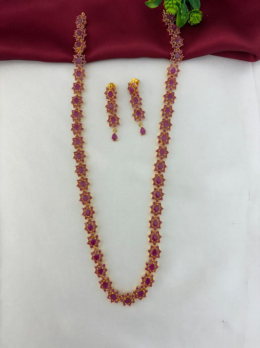 Geometric Glow Ruby Station Long Necklace & Earring Set - Styled overview shot of the ruby necklace and earrings – front view