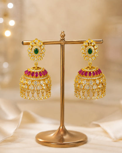 gold-plated ruby emerald floral-dome CZ jhumka earrings displayed as a matching pair – front view