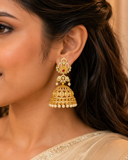 Ruby Gold-Plated CZ Grand Pearl-Look Fringe Jhumka Earrings – Model wearing grand gold-plated CZ jhumka earrings – view 2