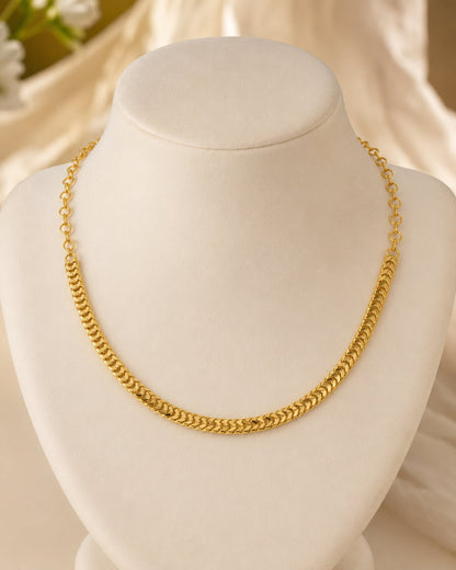 Gold Tone Curb Chain Necklace for Indian Occasion Wear – gold-polished necklace on jewellery display – front view