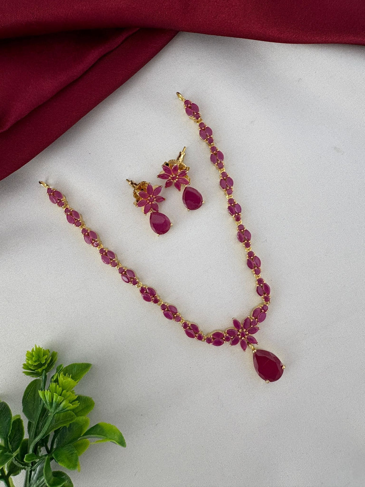 Heritage Ruby CZ Short Necklace Set for Festive Gifting – Heritage Ruby-Tone CZ Short Necklace Set and earrings – front view