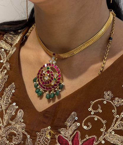 Jadau Kundan Mayur Pathakam Peacock Pendant – Mayur Pathakam Peacock Pendant styled on a chain with a brown – view 6