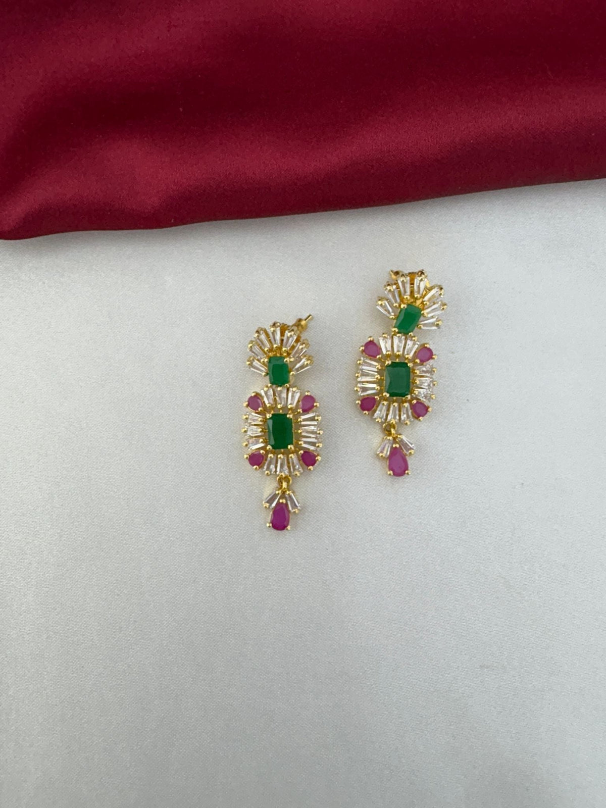 Close-up of Pastel Dreams Multi-Color AD earrings showcasing the emerald and ruby colored stones – view 2