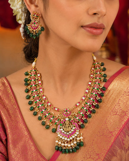 pearl-look drop floral jadau kundan necklace set with matching earrings on jewellery display – view 2