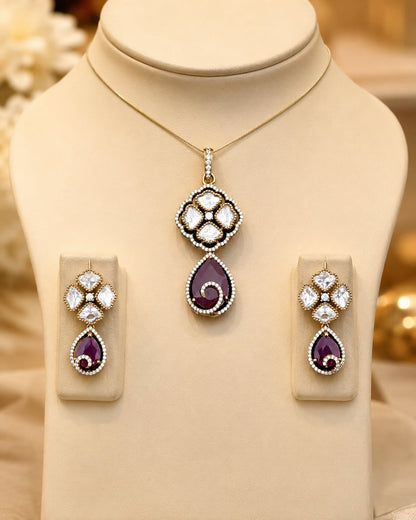 Ruby AD/CZ Teardrop Pendant Set for Receptions – ruby-tone pendant set on jewellery display – front view