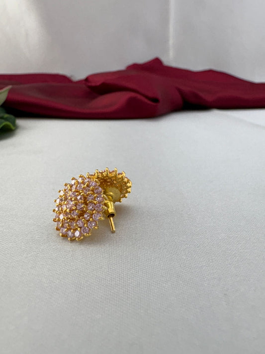 Sweetheart baby pink AD stud earrings angled view displaying gold post and earring back details – view 2